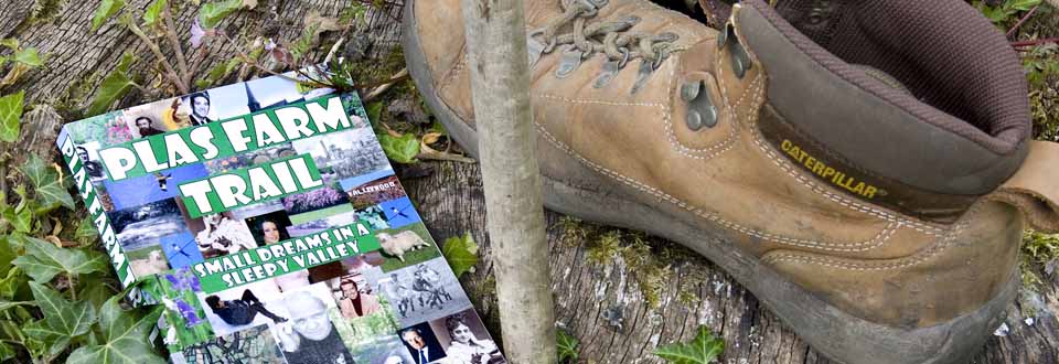 Farm trail guidebook with walking stick and walking boots